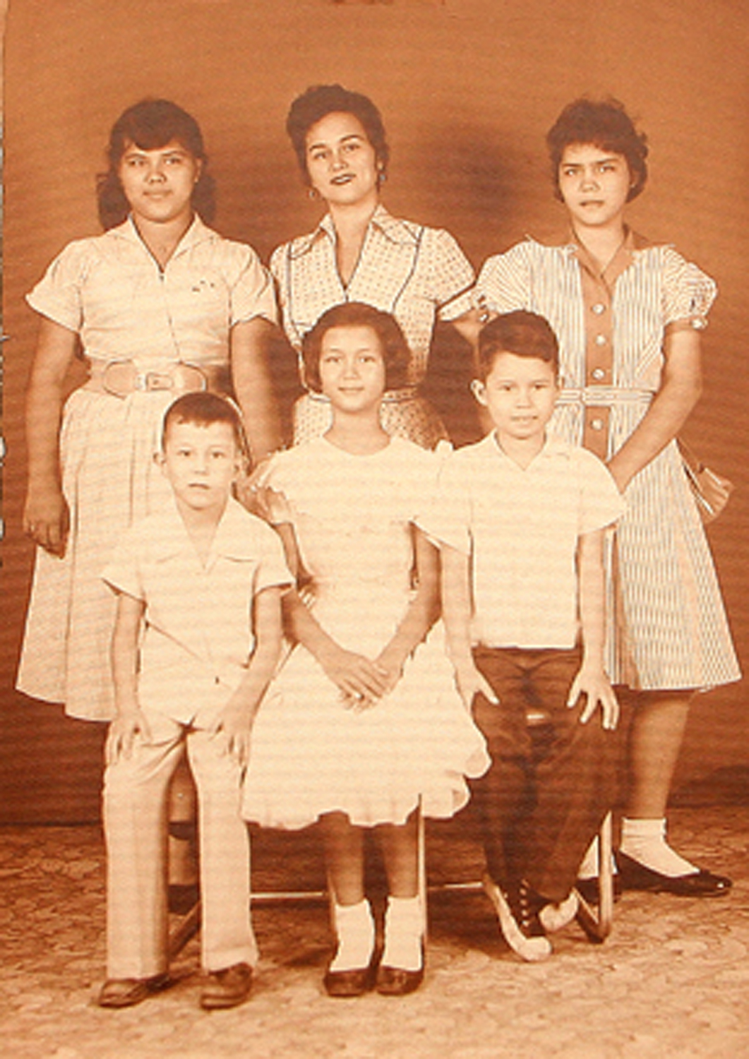 cornys_2_half_brothers_cecillight_pants_and_carlitos_quirino-_their_mother_is_middle_rear_with_their_half_sisters_